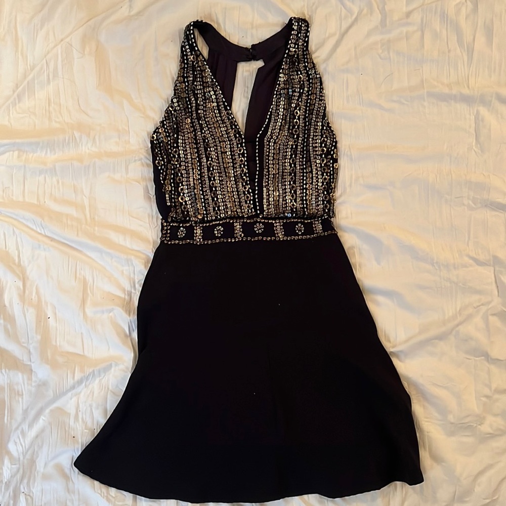 Short black dress with sequence.